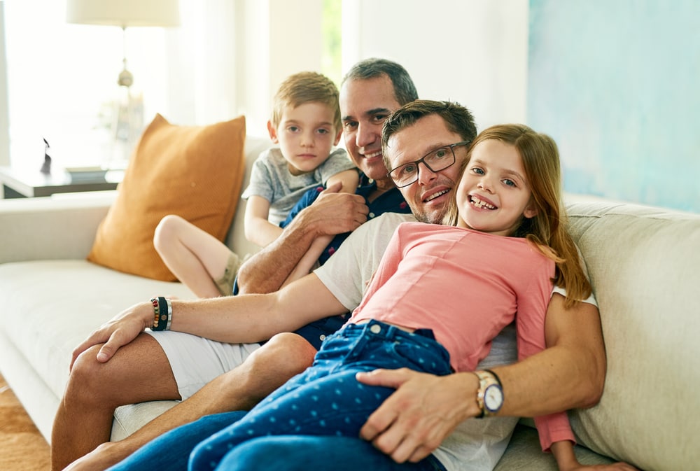 Family is the only thing that matters. Cropped portrait of an affectionate family of four on the sofa at home